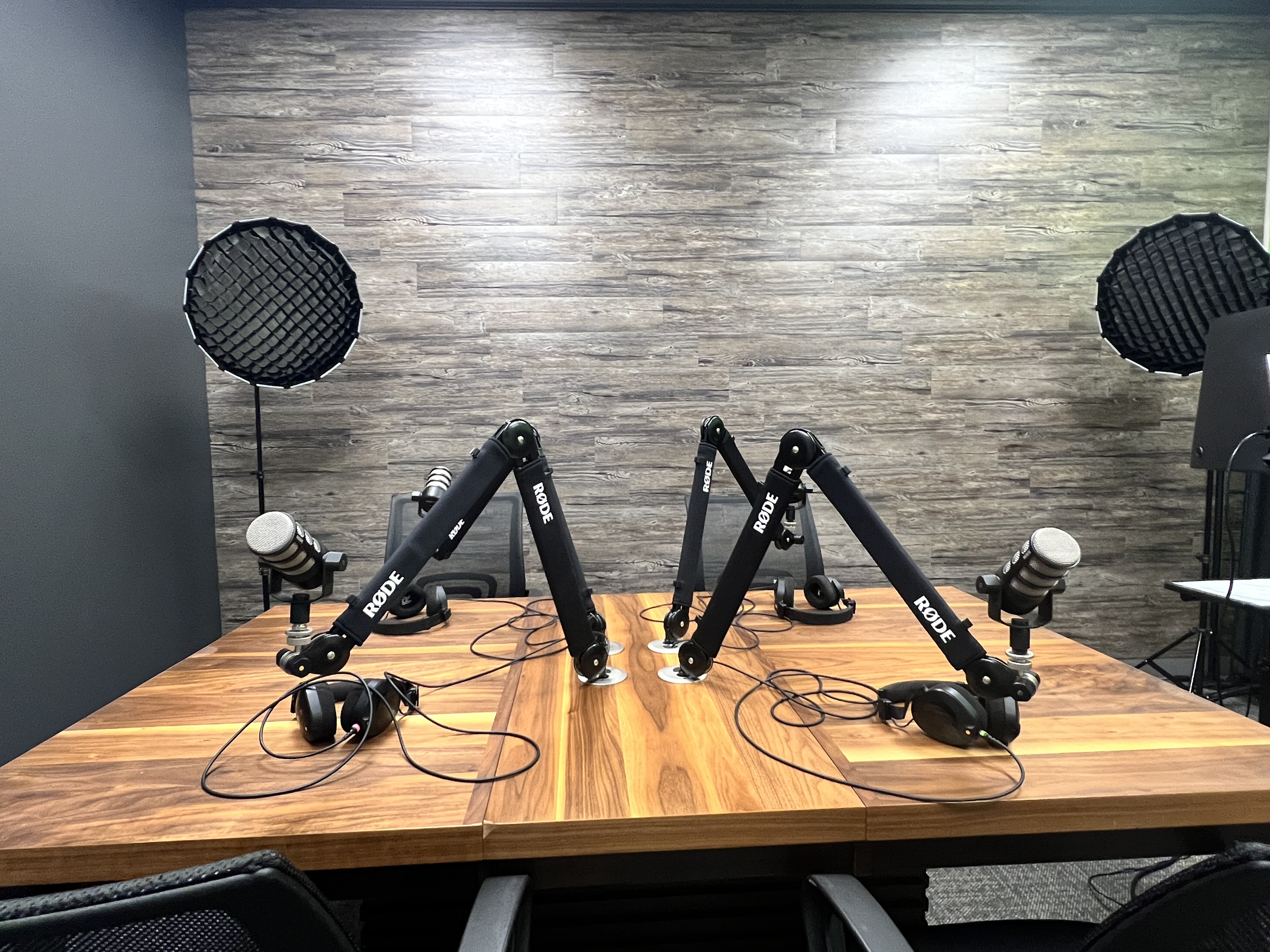 Studio table with four microphone arms set up for recording